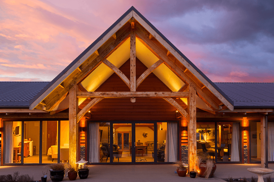 Exterior of a striking alpine timber frame hotel built with mortise and tenon joinery in Hanmer, NZ